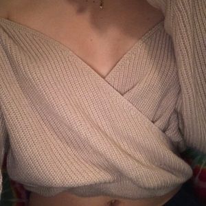 A loose light pink long sleeve